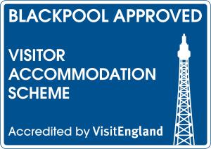 a sign for a blackpool approved visitor accommodation scheme with a tower at California Guest House in Blackpool