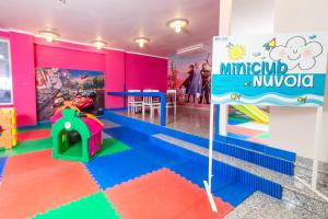 a childrens play room with a mr and mrs monopoly sign at Hotel Elite Cattolica in Cattolica