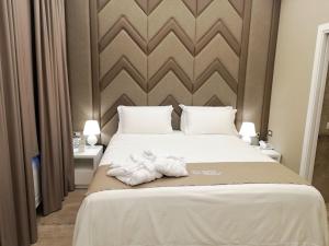 Voodi või voodid majutusasutuse Hotel Parco delle Querce toas