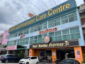 a building with cars parked in front of it at City Boutique Hotel - Bangi in Bangi