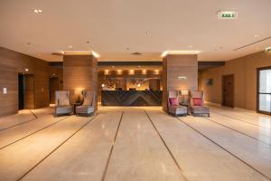 a ballroom with chairs and a dance floor at Crowne Plaza Porto by IHG in Porto