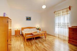 Postel nebo postele na pokoji v ubytování Restored Country House Murva