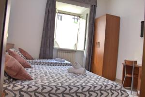 Postel nebo postele na pokoji v ubytování Hotel Ciao