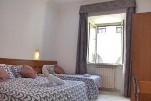 Postel nebo postele na pokoji v ubytování Hotel Ciao