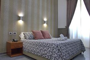 Postel nebo postele na pokoji v ubytování Hotel Ciao