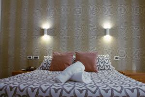 Postel nebo postele na pokoji v ubytování Hotel Ciao