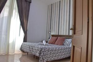 Postel nebo postele na pokoji v ubytování Hotel Ciao