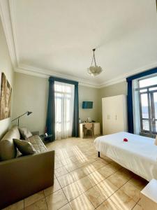 
a bedroom with a large bed and a large window at Best Quality Hotel Dock Milano in Turin
