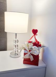 a valentines box with a heart and flowers on a table at Apartment Ane 2 in Tisno
