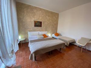 Ліжко або ліжка в номері Appartamenti Giulia - Palazzo Milano