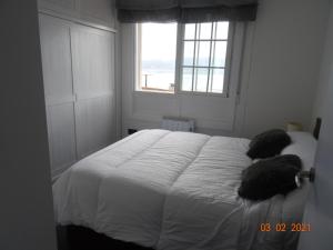Postel nebo postele na pokoji v ubytování Apartamentos Casa Mucha