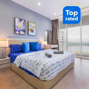 a bedroom with a bed with a top rated sign above it at HostaHome Suites at Encorp Marina, mins to Legoland Malaysia in Nusajaya