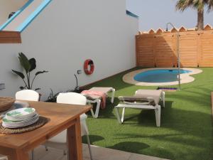 The swimming pool at or close to COZY, Beach House , by MAHBOVILLAS