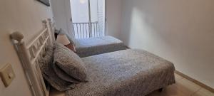 Posteľ alebo postele v izbe v ubytovaní Sa Shei Apartment Tossa de Mar