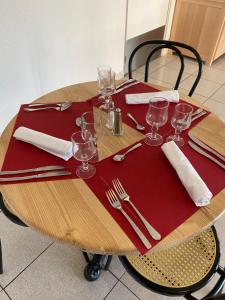 A restaurant or other place to eat at HOTEL RESTAURANT OLYMPE