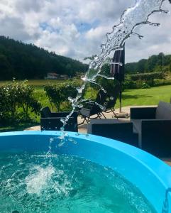 a plunge pool with water shooting into the air at Haere Mai B&B Orust in Henån