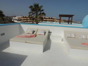 The swimming pool at or close to COZY, Beach House , by MAHBOVILLAS