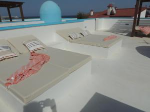 The swimming pool at or close to COZY, Beach House , by MAHBOVILLAS