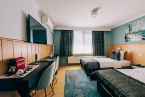 Postel nebo postele na pokoji v ubytování Hotel De Kalvaar
