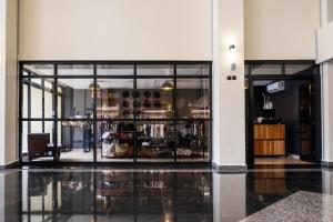 a store front with large glass doors in a building at Mantis Kivu Marina Bay Hotel in Muhari