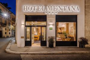 a hotel meriana sign on the side of a building at Hotel Mentana, by R Collection Hotels in Milan