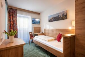 Voodi või voodid majutusasutuse Hotel Wildauerhof toas