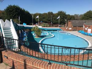 a large swimming pool with a water slide at 2 Bedroom Caravan NV16, Lower Hyde, Shanklin, Isle of Wight in Shanklin