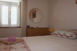 Ein Bett oder Betten in einem Zimmer der Unterkunft Apartments Seka Korčula