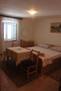 Ein Bett oder Betten in einem Zimmer der Unterkunft Apartments Seka Korčula