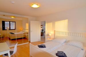 En eller flere senge i et værelse på fewo1846 - Sundowner - luxuriöse Wohnung mit 2 Schlafzimmern und Sonnenterrasse