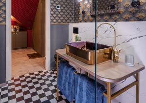 a kitchen with a copper sink on a table at Rezydencja Julin Slow Life dla Gości 16+ in Wydrze +28 photos