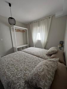 Кровать или кровати в номере Apartamentos La Mar