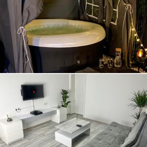 a living room with a tub and a tv at Wohnen direkt an der Rheinpromenade mit Whirlpool und Sauna in Götterswickerhamm