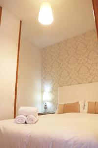 Posteľ alebo postele v izbe v ubytovaní Bcn-rentals apartments in the Old town
