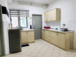 Kuchyň nebo kuchyňský kout v ubytování Residensi Flora