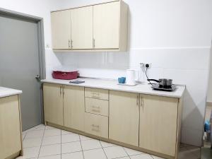 Kuchyň nebo kuchyňský kout v ubytování Residensi Flora