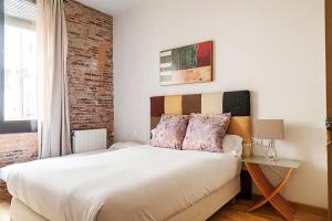 Posteľ alebo postele v izbe v ubytovaní Bcn-rentals apartments in the Old town