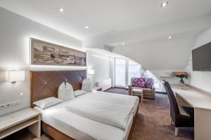 Postel nebo postele na pokoji v ubytování Hotel Garni Christine