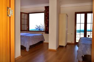 A bed or beds in a room at Miletus Otel Şile