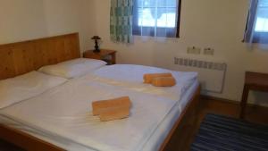 A bed or beds in a room at Chata 412 Tatralandia
