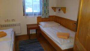 A bed or beds in a room at Chata 412 Tatralandia