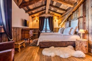 Ένα ή περισσότερα κρεβάτια σε δωμάτιο στο Le Coeur de Courchevel