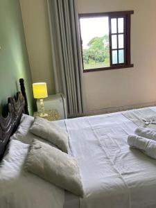 מיטה או מיטות בחדר ב-Pousada Dom Diego