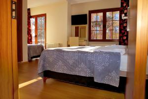 A bed or beds in a room at Miletus Otel Şile