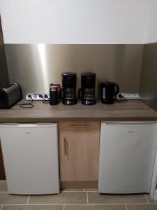 a kitchen counter with a coffee maker on top of it at Gîte Mont Joly in Saint-Gervais-les-Bains