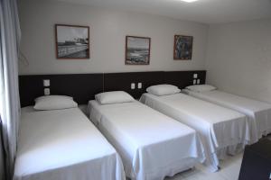 Postel nebo postele na pokoji v ubytování Absolutte Hotel