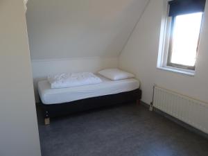 Postel nebo postele na pokoji v ubytování Kustverhuur, Park Schoneveld, Zeemeeuw 203