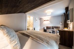 Postel nebo postele na pokoji v ubytování Chalet hôtel le Whymper