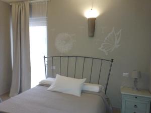 A bed or beds in a room at All'Antica Ruggine