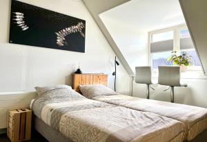 Säng eller sängar i ett rum på B&B Hartje Spakenburg